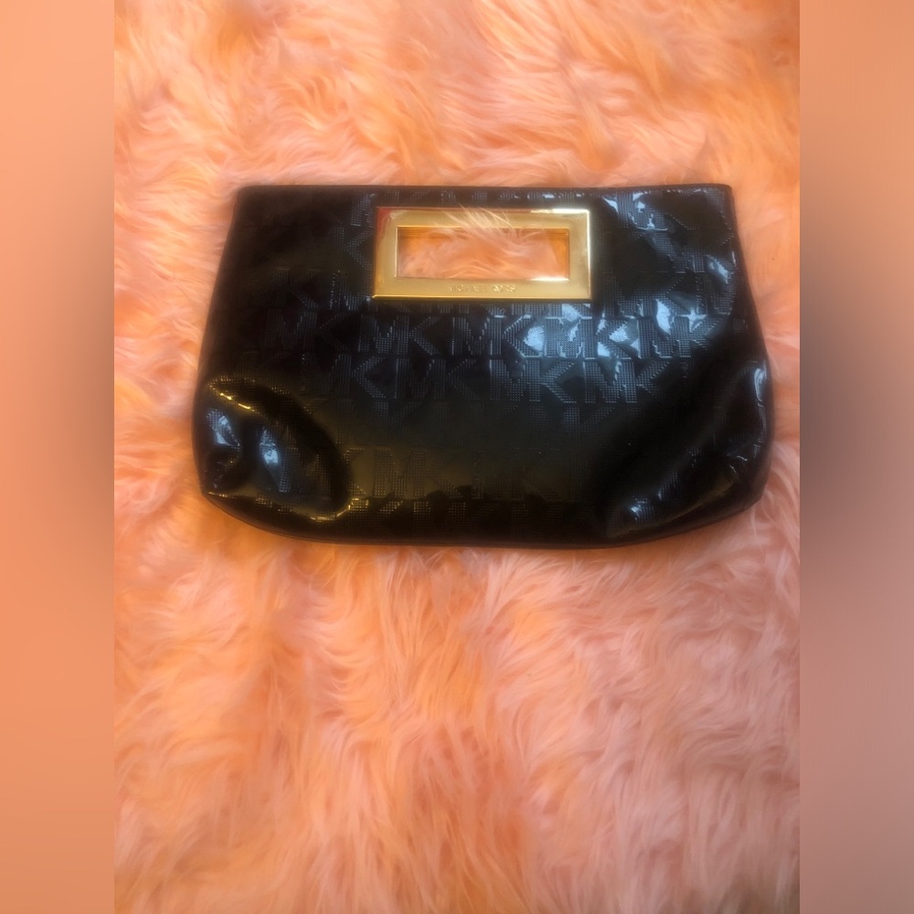 Michael Kors Monogram Clutch Bag.